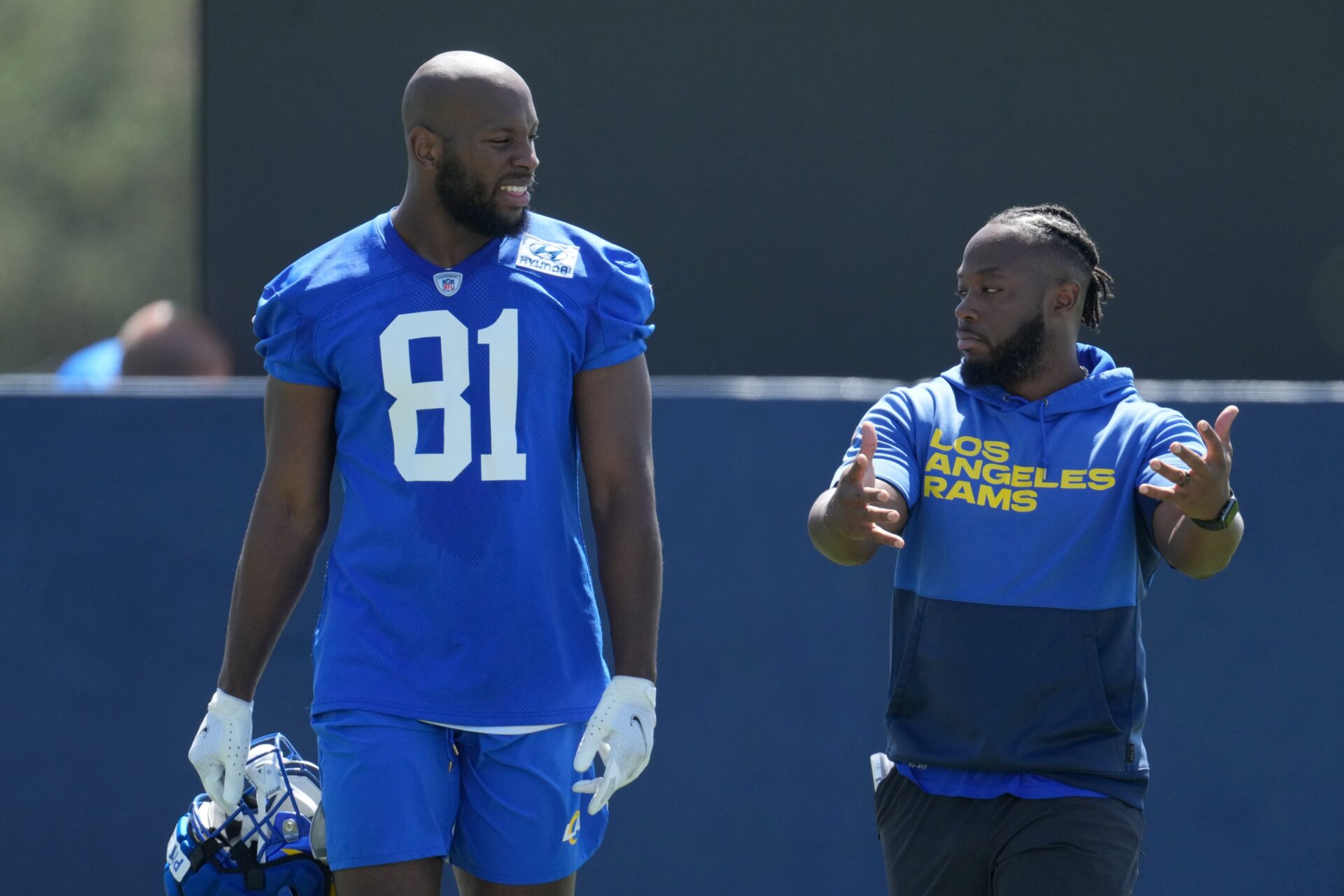 Los Angeles Rams TE Jamal Pettigrew (81) and tight ends coach Thomas Brown talking during minicamp.