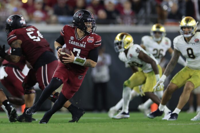 South Carolina Gamecocks QB Spencer Rattler (7) rolls out against the Notre Dame Fighting Irish.