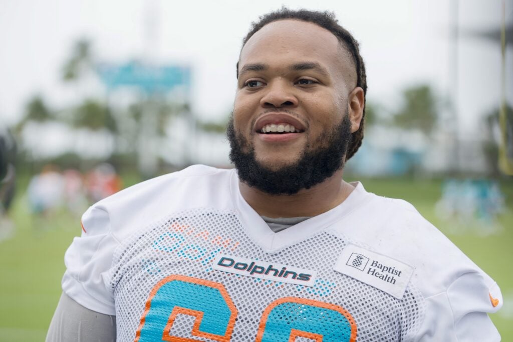 Miami Dolphins offensive lineman Robert Hunt (68) runs onto the field as he  is introduced to the fans before an NFL football game between the Houston  Texans and the Miami Dolphins, Sunday