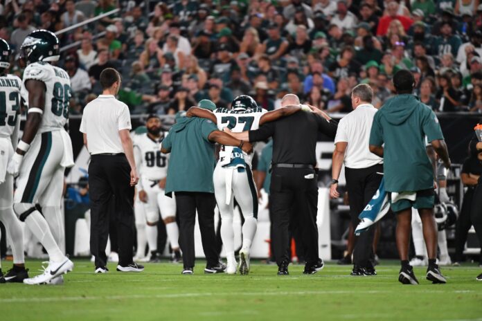 Philadelphia Eagles cornerback Zech McPhearson (27) is helped off the field with an injury against the Cleveland Browns during the second quarter at Lincoln Financial Field.