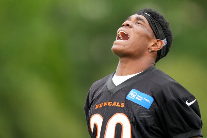 Cam Taylor-Britt (29) reacts to a defensive play during the team’s training camp practice.