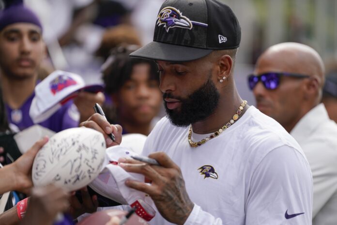 Baltimore Ravens wide receiver Odell Beckham Jr. (3) signs autographs after training camp practice at Under Armour Performance Center.