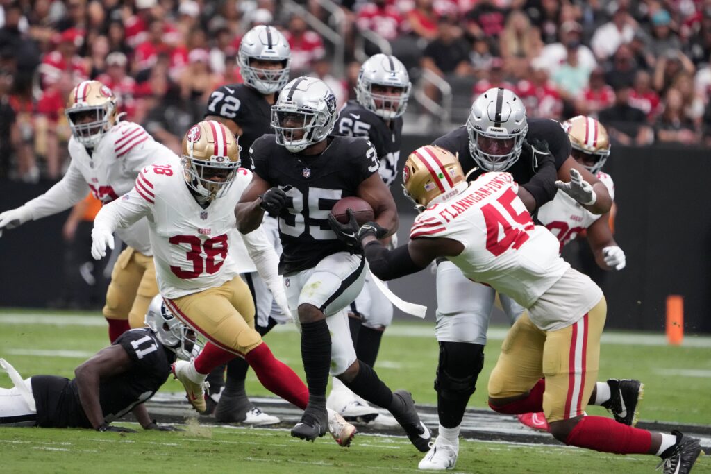 Las Vegas Raiders running back Zamir White (35) carries against