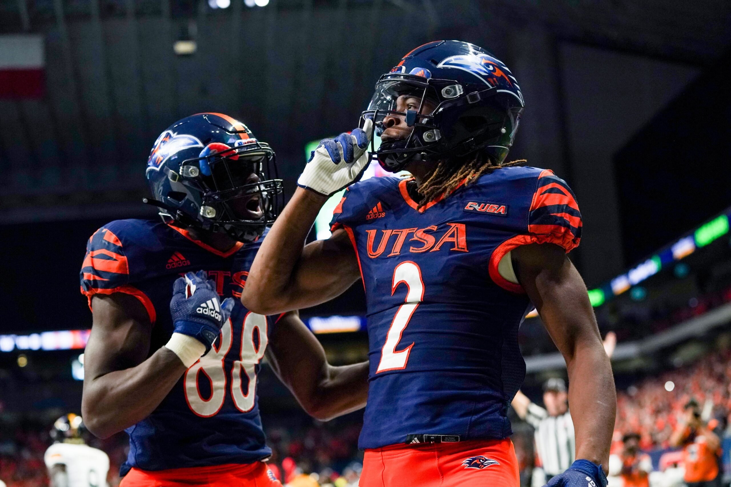 Joshua Cephus (2) and De'Corian Clark (88) celebrate Cephus' first half touchdown against the Southern Miss Golden Eagles at the Alamodome.
