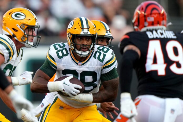 AJ Dillon (28) carries the ball in the first quarter during a Week 1 NFL preseason game between the Green Bay Packers and the Cincinnati Bengals.