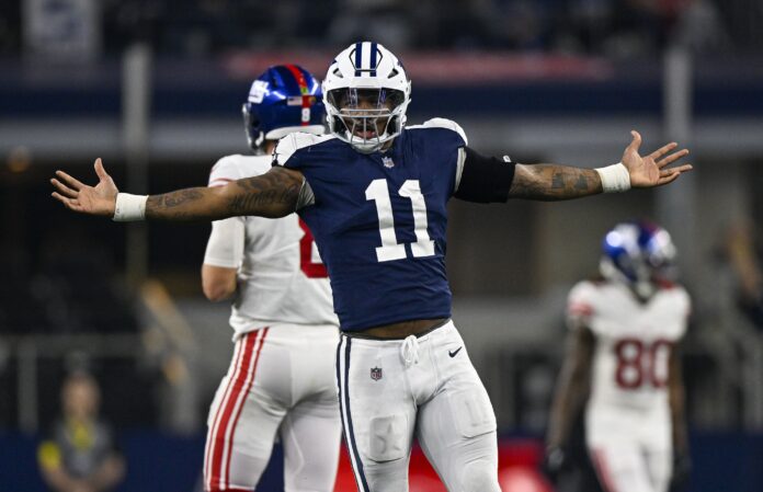 Micah Parsons (11) celebrates after he sacks New York Giants quarterback Daniel Jones (8) during the game between the Dallas Cowboys and the New York Giants at AT&T Stadium.