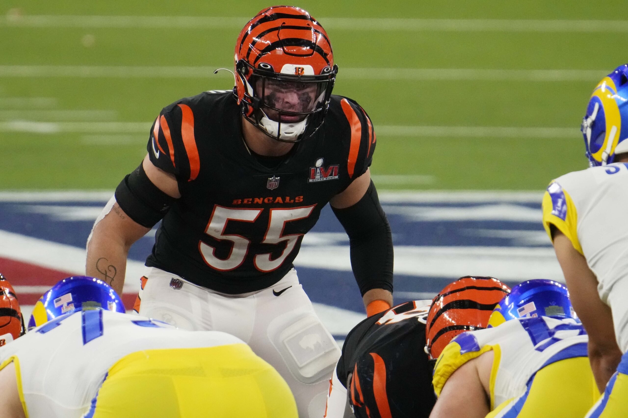 Cincinnati Bengals linebacker Logan Wilson (55) runs for the play during an  NFL wild-card football game against the Baltimore Ravens on Sunday, Jan.  15, 2023, in Cincinnati. (AP Photo/Emilee Chinn Stock Photo 