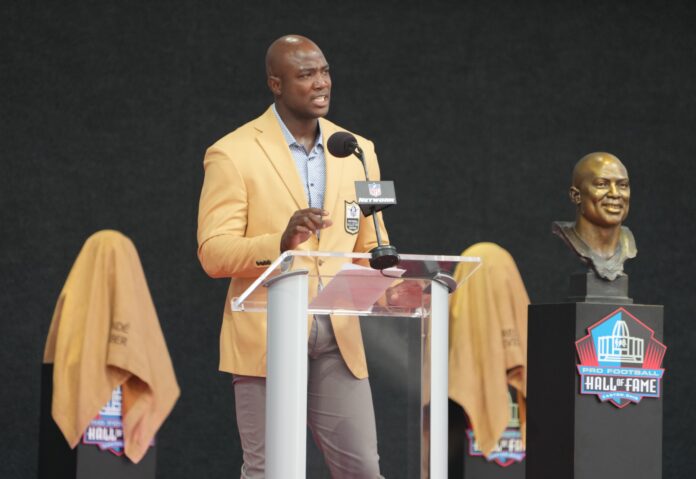 DeMarcus Ware speaks after his bust is unveiled during the 2023 Pro Football Hall of Fame Enshrinement at Tom Benson Hall of Fame Stadium.