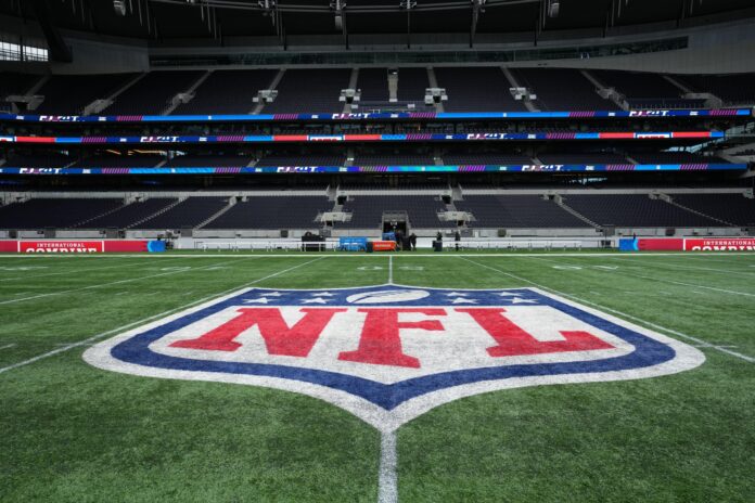 A general overall view of the NFL shield logo at midfield Tottenham Hotspur Stadium.
