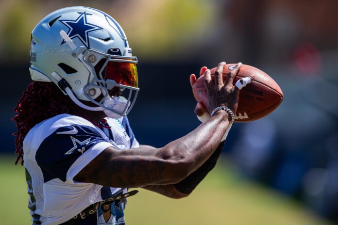 Dallas Cowboys WR CeeDee Lamb catches a pass in practice.