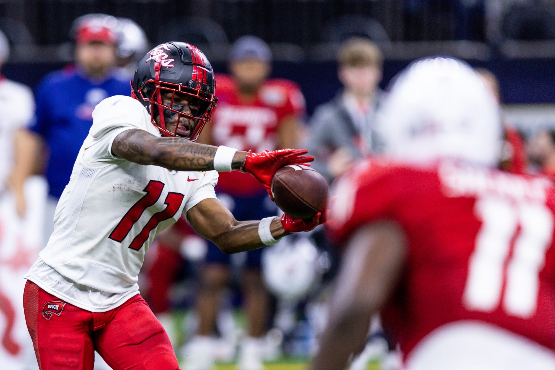 Dec 21, 2022; New Orleans, Louisiana, USA; Western Kentucky Hilltoppers wide receiver Malachi Corley (11) catches a pass against South Alabama Jaguars defensive lineman Jamie Sheriff (11) during the second half at Caesars Superdome.