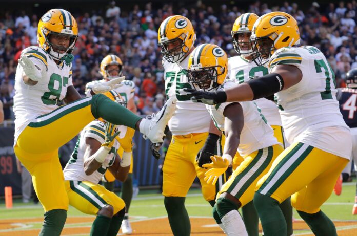 Green Bay Packers players celebrate after a touchdown.