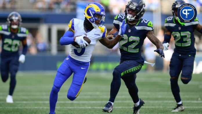 Los Angeles Rams wide receiver Tutu Atwell (5) carries the ball after a catch while Seattle Seahawks cornerback Tre Brown (22) chases during the second half at Lumen Field.