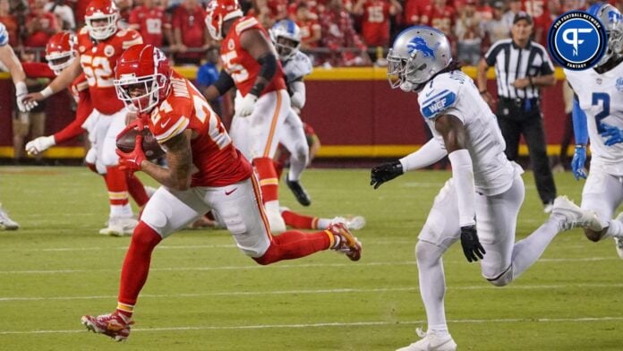 Kansas City Chiefs wide receiver Skyy Moore (24) catches a pass as Detroit Lions cornerback Cameron Sutton (1) defends during the second half at GEHA Field at Arrowhead Stadium.