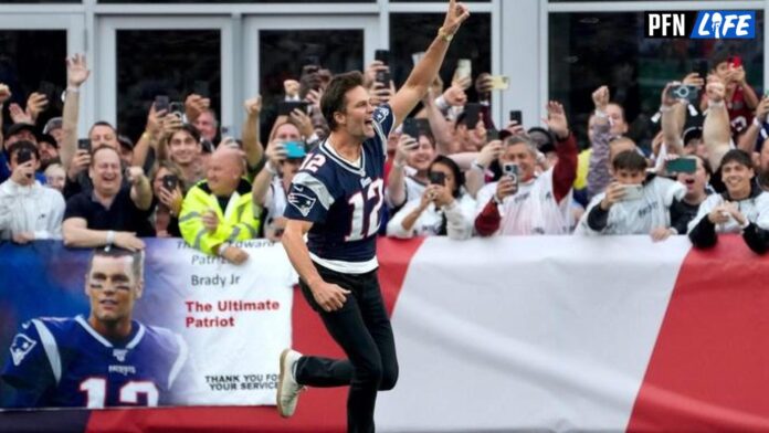 Former New England Patriots quarterback, Tom Brady, runs on to the field at Gillette Stadium on Sunday evening to welcome fans as the Patriots announce they will induct him into the Patriots Hall of Fame in June.