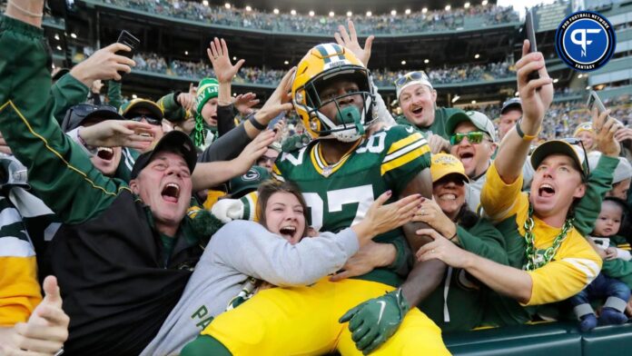 Green Bay Packers wide receiver Romeo Doubs celebrates with fans after scoring a touchdown against the New England Patriots on Oct. 2 at Lambeau Field.