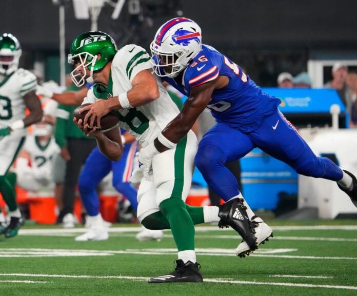 Buffalo Bills defensive end Leonard Floyd (56) sacks New York Jets quarterback Aaron Rodgers (8) during the first quarter at MetLife Stadium. Rodgers left the game with an injury after the play.