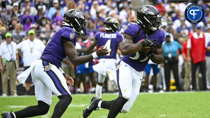Baltimore Ravens running back Gus Edwards (35) carries the ball against the Houston Texans during the second half at M&T Bank Stadium.