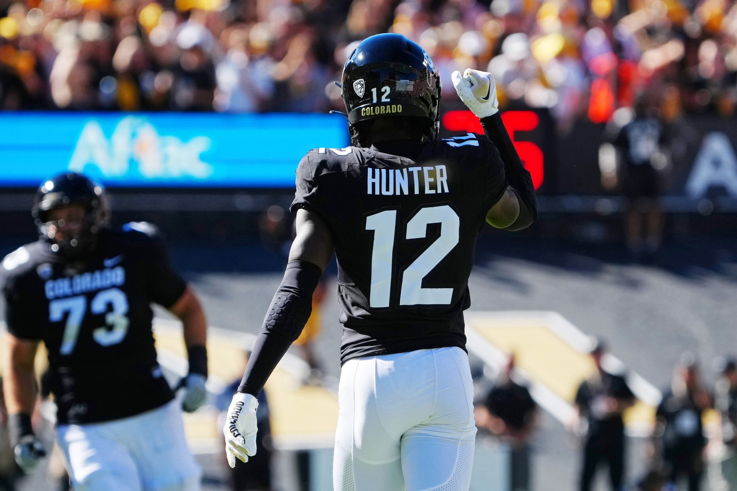 Sep 9, 2023; Boulder, Colorado, USA; Colorado Buffaloes cornerback Travis Hunter (12) reacts after a turnover against the Nebraska Cornhuskers in the first quarter at Folsom Field. Mandatory Credit: Ron Chenoy-USA TODAY Sports