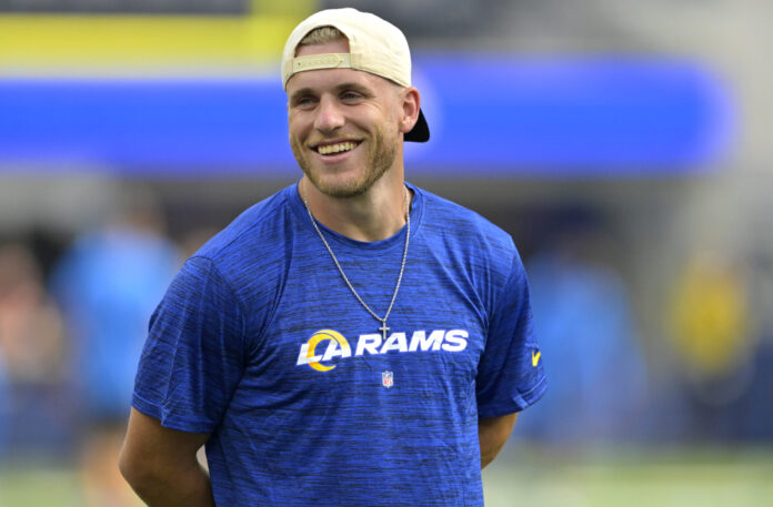 Los Angeles Rams wide receiver Cooper Kupp (10) looks on from the field prior to the game against the Los Angeles Chargers at SoFi Stadium.