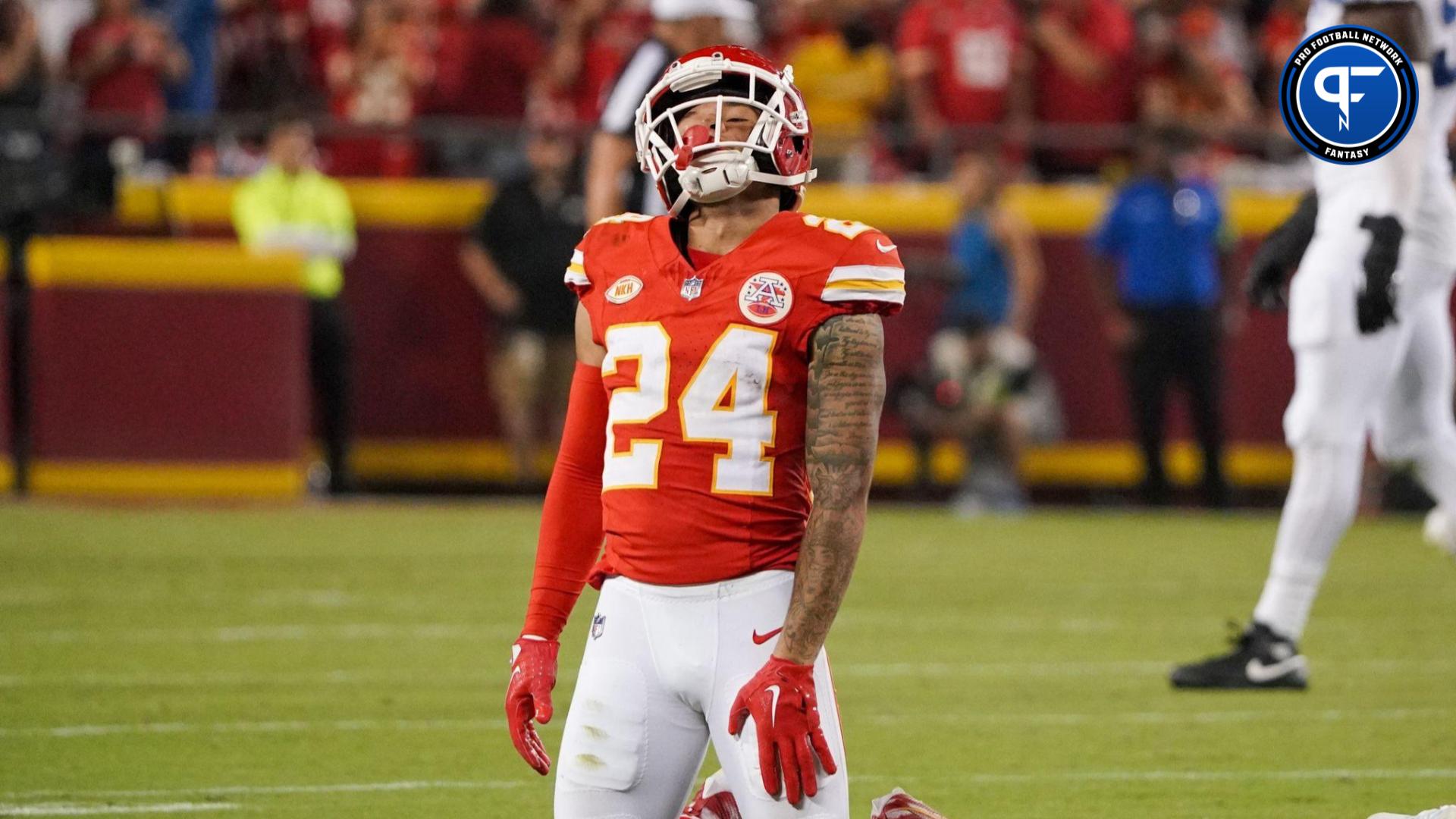 Kansas City Chiefs' Skyy Moore (24) flexes before their NFL football game  against the Arizona Cardinals