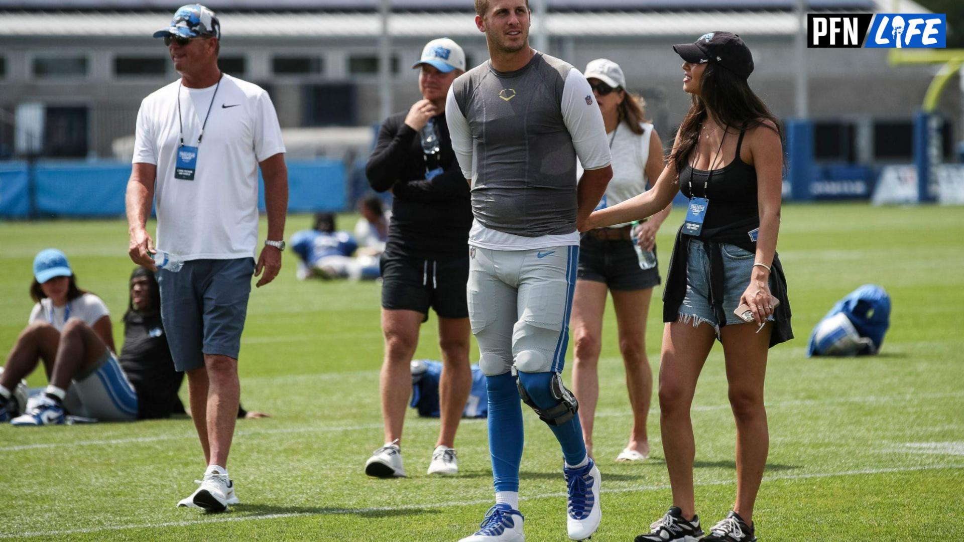 Detroit Lions quarterback Jared Goff and his fiancee Christen Harper walk off the field after the joint practice with New York Giants at Detroit Lions headquarters and training facility in Allen Park