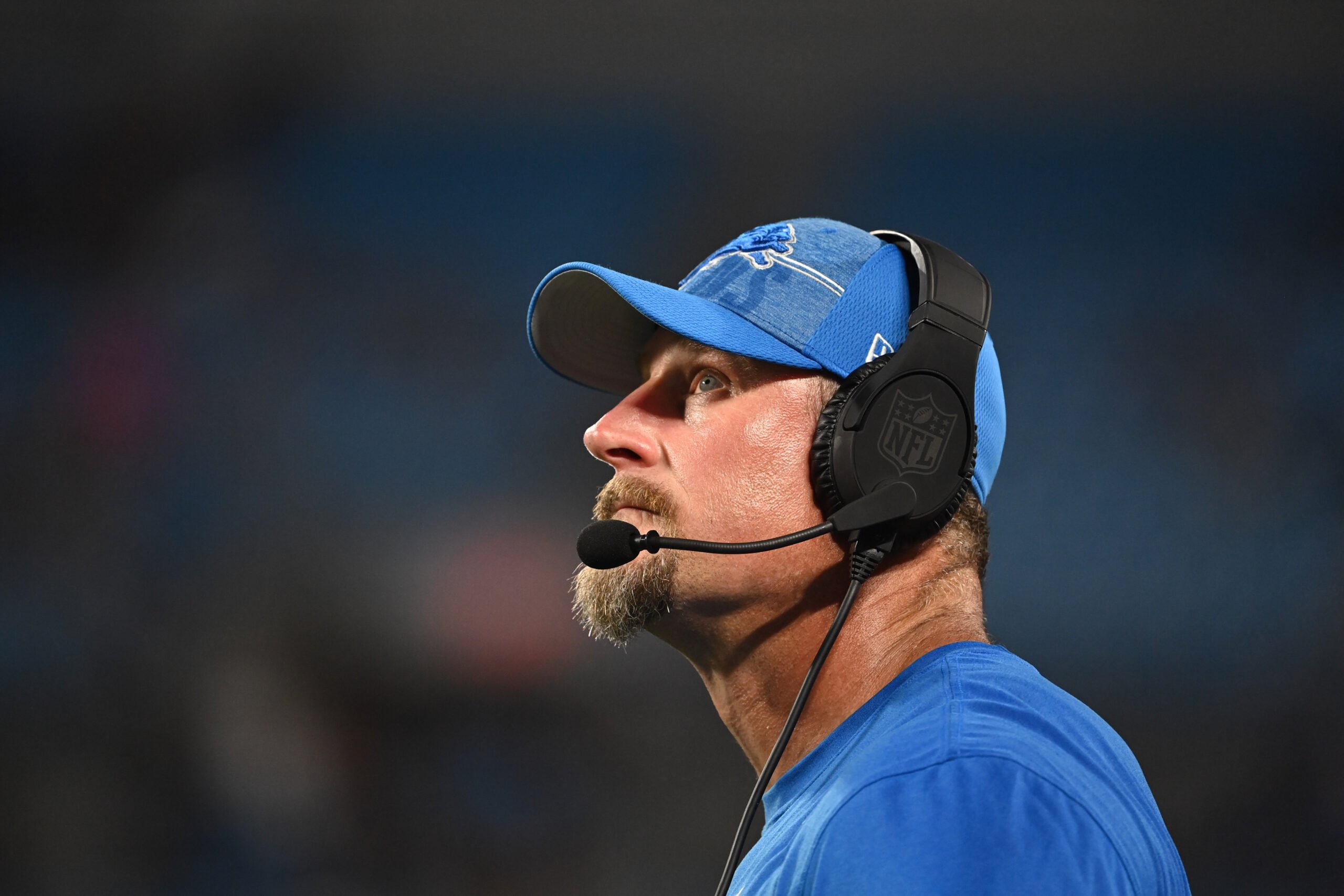 Detroit Lions head coach Dan Campbell runs off the field after the