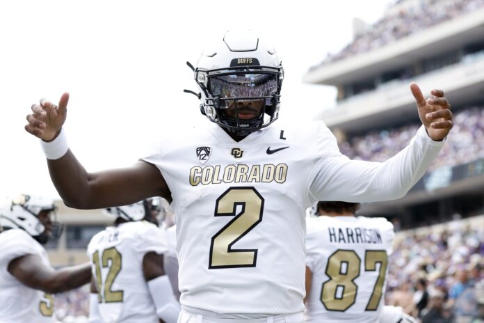 Colorado Buffaloes quarterback Shedeur Sanders (2) celebrates a touchdown in the first quarter against the TCU Horned Frogs at Amon G. Carter Stadium.