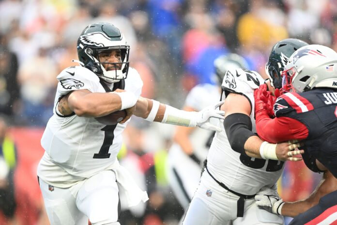 Philadelphia Eagles QB Jalen Hurts (1) rushes the ball against the New England Patriots.