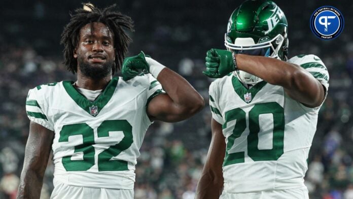 New York Jets running back Michael Carter (32) and running back Breece Hall (20) pose for a photo before the game against the Buffalo Bills at MetLife Stadium.