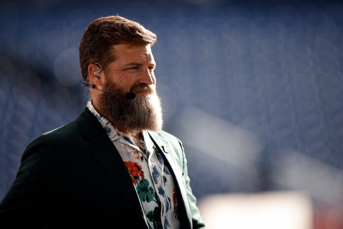 Oct 6, 2022; Denver, Colorado, USA; Thursday Night Football analyst Ryan Fitzpatrick looks on before the game between the Denver Broncos and the Indianapolis Colts at Empower Field at Mile High.