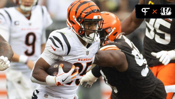 Cincinnati Bengals running back Chris Evans (25) runs the ball against the Cleveland Browns during the first quarter at Cleveland Browns Stadium.
