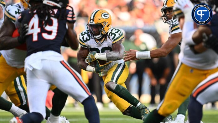 Green Bay Packers running back Aaron Jones (33) runs for a 1-yard touchdown in the second half against the Chicago Bears at Soldier Field.