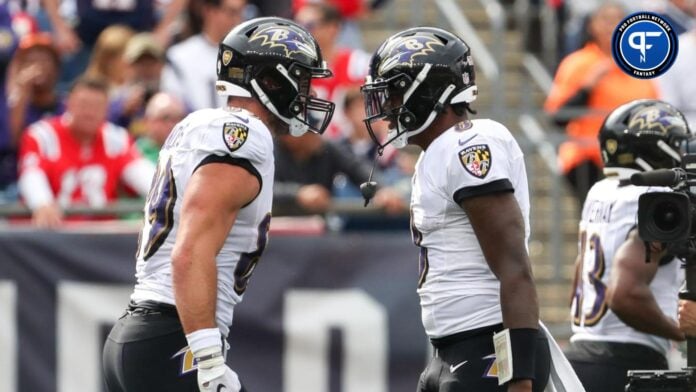 Lamar Jackson (8) and Baltimore Ravens tight end Mark Andrews (89) celebrate after a touchdown during the first half against the New England Patriots at Gillette Stadium.