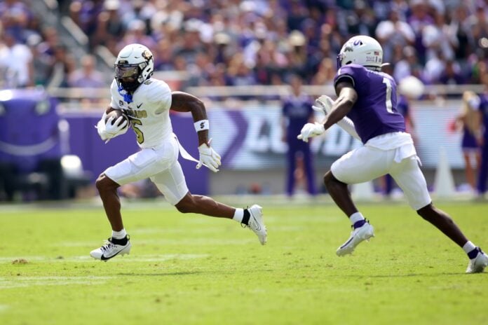 Jimmy Horn Jr. (5) runs the ball against TCU Horned Frogs safety Abe Camara (1) in the first quarter at Amon G. Carter Stadium.