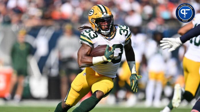 Green Bay Packers running back Aaron Jones (33) runs with the ball against the Chicago Bears at Soldier Field.