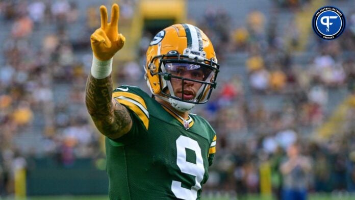 Green Bay Packers wide receiver Christian Watson (9) waves to fans before game against the New England Patriots at Lambeau Field.