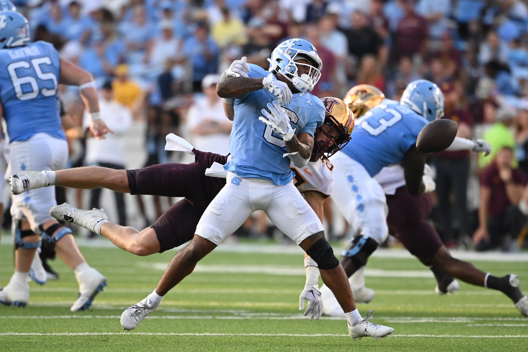 Nate McCollum (6) is unable to catch the ball as Minnesota Golden Gophers defensive back Jack Henderson (20) defends in the fourth quarter at Kenan Memorial Stadium.