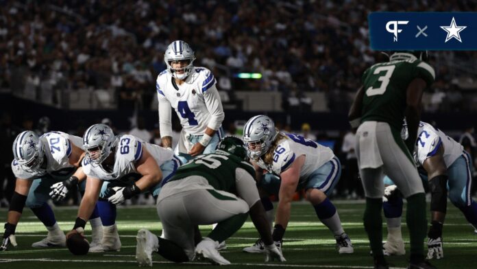 Dak Prescott (4) calls a play at the line of scrimmage in the fourth quarter against the New York Jets at AT&T Stadium.