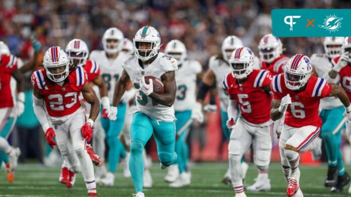 Miami Dolphins RB Raheem Mostert (31) runs for a touchdown against the New England Patriots.