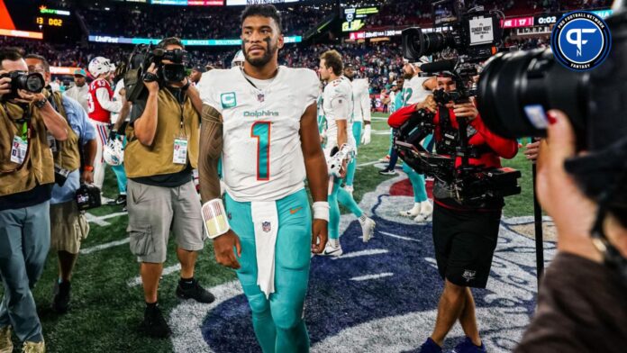 Miami Dolphins quarterback Tua Tagovailoa (1) on the field after defeating the New England Patriots at Gillette Stadium.