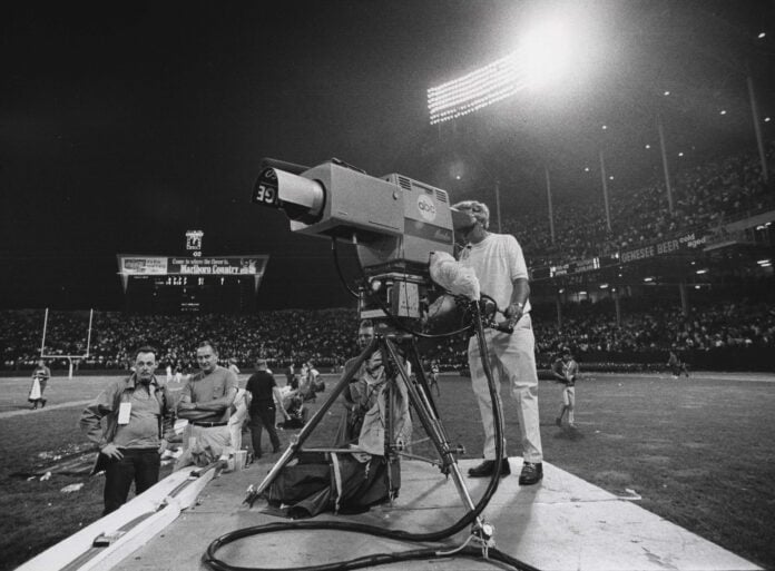 ABC television cameras record the action during the first ever Monday Night Football game. The Browns won the game in front of a record Cleveland football crowd of 85,703 at Cleveland Stadium.