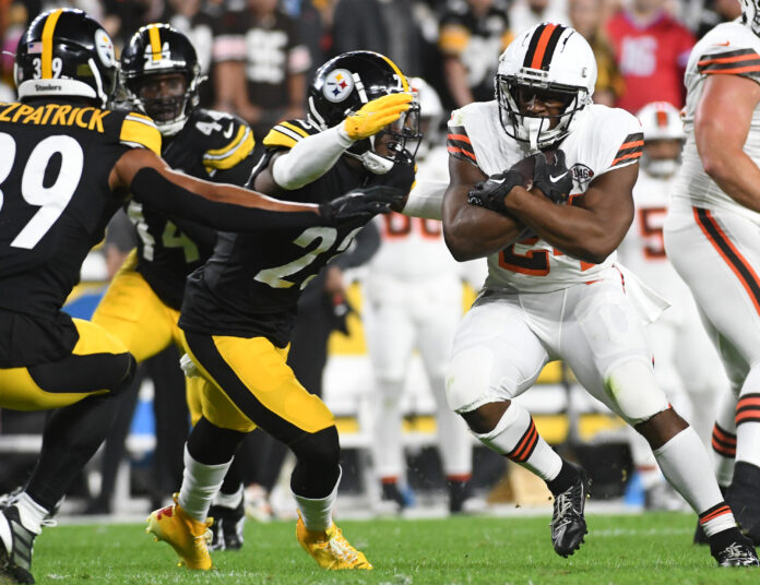 Sep 18, 2023; Pittsburgh, Pennsylvania, USA; Cleveland Browns running back Nick Chubb (24) is stopped by Pittsburgh Steelers safety Damontae Kazee (23) during the first quarter at Acrisure Stadium. Mandatory Credit: Philip G. Pavely-USA TODAY Sports