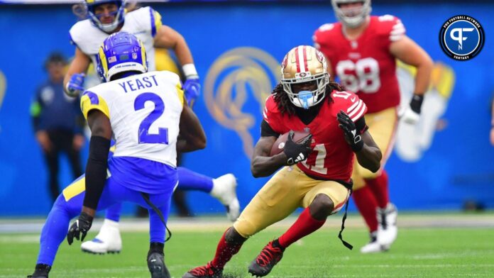 San Francisco 49ers wide receiver Brandon Aiyuk (11) runs the ball against Los Angeles Rams safety Russ Yeast (2) during the second half at SoFi Stadium.