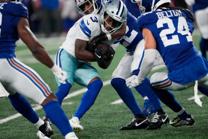 Dallas Cowboys wide receiver Brandin Cooks (3) runs with the ball until he is stopped by the members of the Giants defense. Sunday, September 10, 2023
