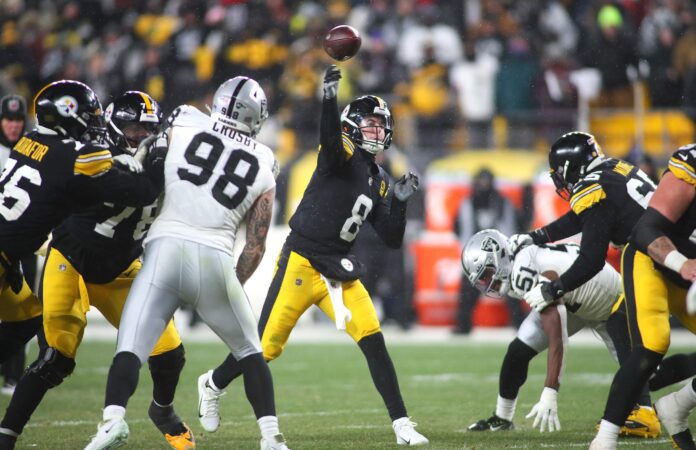 Pittsburgh Steelers Kenny Pickett (8) throws the game winning pass to George Pickens securing the Steelers 13-10 win at Acrisure Stadium in Pittsburgh, PA on December 24, 2022.
