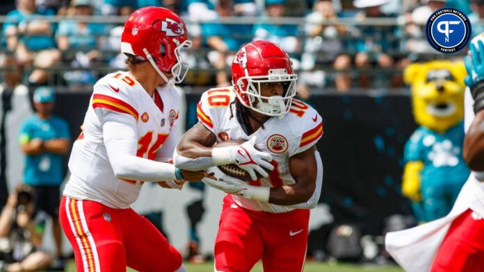 Patrick Mahomes (15) hands the ball off to running back Isiah Pacheco (10) against the Jacksonville Jaguars during the first quarter at EverBank Stadium.