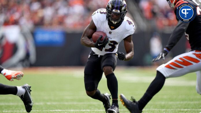 Baltimore Ravens RB Justice Hill (43) rushes the ball against the Cincinnati Bengals.