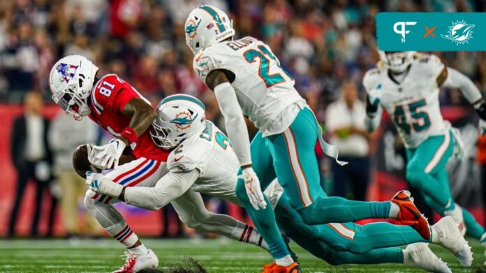 New England Patriots wide receiver Demario Douglas (81) fumbles the ball under pressure from Miami Dolphins linebacker Bradley Chubb (2) in the second quarter at Gillette Stadium.