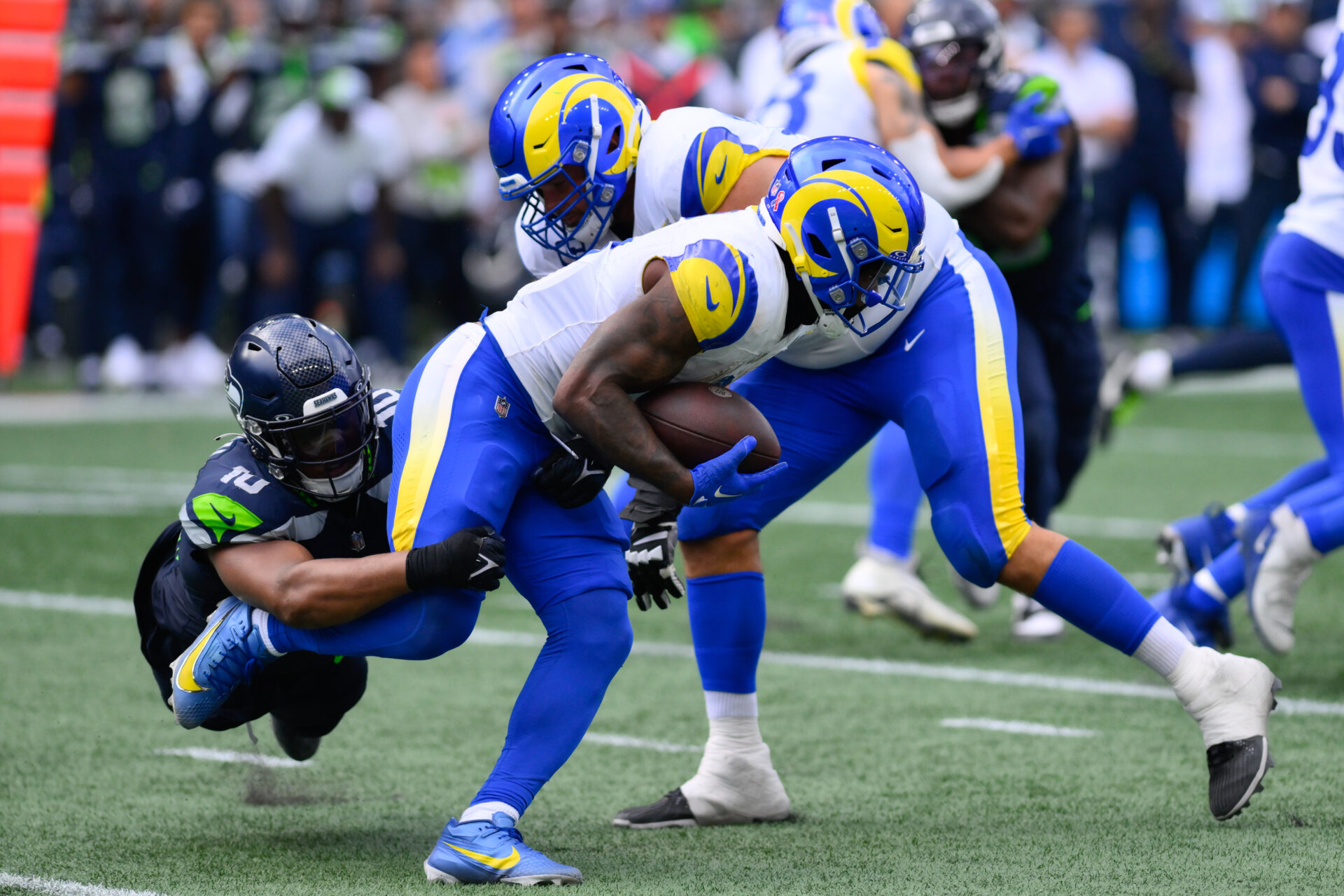 Seattle Seahawks linebacker Uchenna Nwosu (10) tackles Los Angeles Rams running back Cam Akers (3) during the second half at Lumen Field.